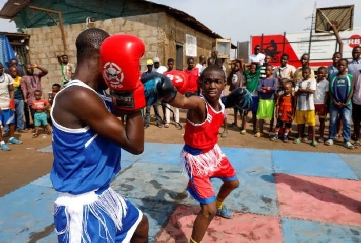 Kid boxers train at an outdoor boxing gym in Adura playground, in Lagos